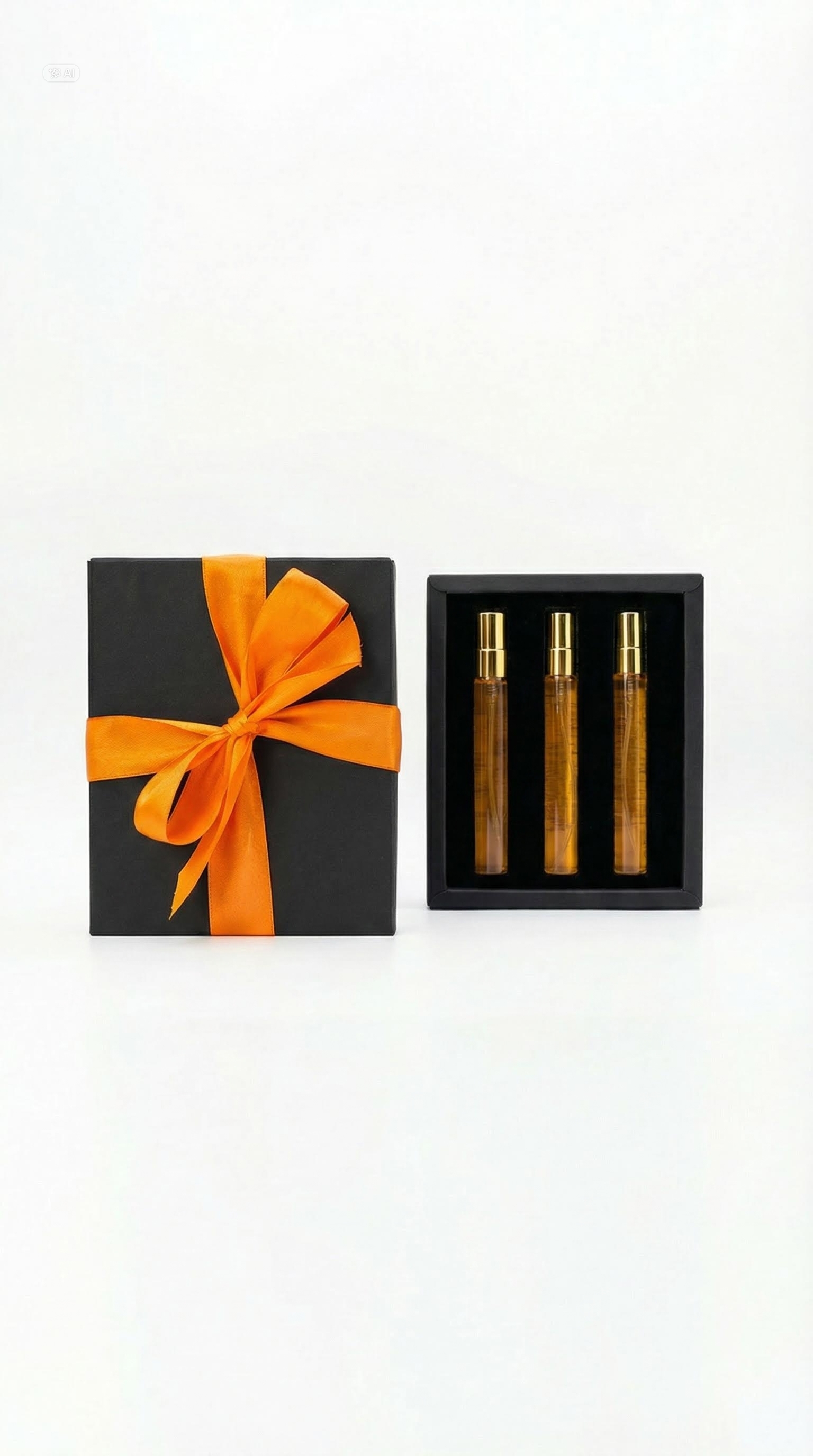 Black gift box with orange ribbon beside three amber aroma vials